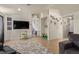 Bright open-concept living room with tile flooring, TV and accessories at 5019 Cactus Mesa Way, North Las Vegas, NV 89031