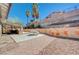 Wide view of backyard showing a patio area with a built-in BBQ and outdoor seating at 5049 Hibbetts Ct, Las Vegas, NV 89103