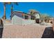 View of the home's exterior showing the back yard, patio, and outdoor dining area at 5049 Hibbetts Ct, Las Vegas, NV 89103