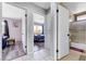 Hallway view showcases a bedroom and bathroom, blending comfort and functionality at 5049 Hibbetts Ct, Las Vegas, NV 89103