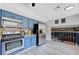 Updated kitchen with stainless steel appliances, granite counters and blue cabinets at 5049 Hibbetts Ct, Las Vegas, NV 89103