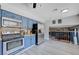 Updated kitchen with stainless steel appliances, granite counters and blue cabinets at 5049 Hibbetts Ct, Las Vegas, NV 89103