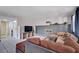 Spacious living room with a fireplace, tile flooring, and comfortable seating area at 5049 Hibbetts Ct, Las Vegas, NV 89103