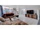 Large living area with staircase, tile flooring, TV and speakers, and comfortable seating at 5049 Hibbetts Ct, Las Vegas, NV 89103