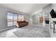 Bright living room features large windows, tile flooring, and neutral tones at 5049 Hibbetts Ct, Las Vegas, NV 89103