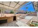Outdoor patio features a built-in brick BBQ and sink under a covered pergola at 5049 Hibbetts Ct, Las Vegas, NV 89103