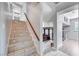 Tiled staircase and open landing offer a glimpse into the living room and upstairs hall at 5049 Hibbetts Ct, Las Vegas, NV 89103