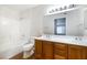 Spacious bathroom featuring dual sinks, a white vanity top, and a shower-tub combo at 5130 Mandalay Springs Dr # 102, Las Vegas, NV 89120