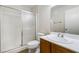 Bathroom with a white tub and shower, a toilet, and a wooden vanity with a white countertop at 5130 Mandalay Springs Dr # 102, Las Vegas, NV 89120