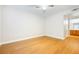 Empty bedroom with light wood floors and an en suite bathroom at 5130 Mandalay Springs Dr # 102, Las Vegas, NV 89120