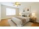 Bright bedroom featuring a comfortable bed, soft lighting, and minimalist decor at 5130 Mandalay Springs Dr # 102, Las Vegas, NV 89120