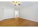 Empty bedroom featuring hardwood floors, double closet, and neutral wall paint at 5130 Mandalay Springs Dr # 102, Las Vegas, NV 89120