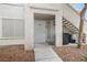 Charming condo unit exterior featuring a private entrance and outdoor staircase at 5130 Mandalay Springs Dr # 102, Las Vegas, NV 89120