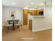 Open floor plan showcasing the kitchen and a dining area with modern decor at 5130 Mandalay Springs Dr # 102, Las Vegas, NV 89120