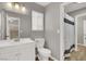 Contemporary bathroom features a large mirror, updated fixtures, and a shower/tub combo at 537 Inness Ave, Henderson, NV 89011