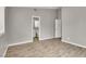 Spacious bedroom with laminate floors and an open doorway to the bathroom at 537 Inness Ave, Henderson, NV 89011