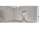 The bedroom features neutral walls and wood floors leading to a bathroom and sliding door at 537 Inness Ave, Henderson, NV 89011