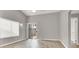 This bedroom features a sliding door to the backyard, neutral walls, and wood floors at 537 Inness Ave, Henderson, NV 89011