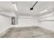 A clean, empty garage with storage racks, overhead lighting, and a water heater at 537 Inness Ave, Henderson, NV 89011