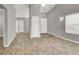 A living room with wood floors, neutral walls, a ceiling fan, and bright lighting at 537 Inness Ave, Henderson, NV 89011