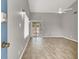Bright living room with wood floors, sliding door to backyard, and a ceiling fan at 537 Inness Ave, Henderson, NV 89011