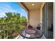 Cozy balcony with iron railing and table, an ideal spot for enjoying the outdoors at 5614 Bishop Flowers St, Las Vegas, NV 89130