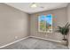 An empty bedroom with a large window with view, carpet and neutral paint at 5614 Bishop Flowers St, Las Vegas, NV 89130