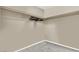 A closet with clothing rod, hangers and neutral-colored walls at 5614 Bishop Flowers St, Las Vegas, NV 89130
