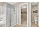 Main bathroom showcasing a walk-in shower with storage and access to the walk-in closet at 5614 Bishop Flowers St, Las Vegas, NV 89130