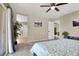 Comfortable main bedroom with a ceiling fan, balcony access, and an en-suite bathroom at 5614 Bishop Flowers St, Las Vegas, NV 89130