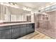 The bathroom boasts double sinks, granite countertops, and a glass-enclosed shower at 5671 Camilla Cellars Ct, Las Vegas, NV 89141