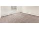 A blank canvas, this bedroom offers neutral carpets, and plenty of natural light at 5671 Camilla Cellars Ct, Las Vegas, NV 89141