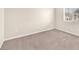 A blank canvas, this bedroom offers neutral carpets, and plenty of natural light at 5671 Camilla Cellars Ct, Las Vegas, NV 89141