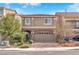 Charming two-story home with red-tiled roof, manicured front yard, and a two-car garage at 5671 Camilla Cellars Ct, Las Vegas, NV 89141