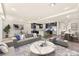 Comfortable living room with stylish decor, an open layout, and seamless access to the kitchen at 5671 Camilla Cellars Ct, Las Vegas, NV 89141