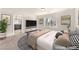 This staged main bedroom includes en-suite access and a seating area at 5671 Camilla Cellars Ct, Las Vegas, NV 89141