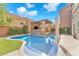 Stunning outdoor pool with a built-in bar and entertainment area at 5671 Camilla Cellars Ct, Las Vegas, NV 89141