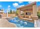 Resort-style pool with swim-up bar seating and outdoor entertainment pavilion at 5671 Camilla Cellars Ct, Las Vegas, NV 89141