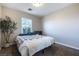 Comfortable bedroom featuring a bright window and a serene view for a peaceful retreat at 6745 Jackson Junction St, Las Vegas, NV 89149