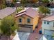 Two-story home with garage and well-maintained landscaping, set in a residential area at 6745 Jackson Junction St, Las Vegas, NV 89149