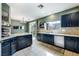 Well lit eat in kitchen with granite counter tops and stainless steel appliances at 6745 Jackson Junction St, Las Vegas, NV 89149