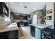 Well-lit kitchen with stainless steel appliances, a breakfast bar, and an undermount sink at 6745 Jackson Junction St, Las Vegas, NV 89149