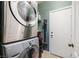 Efficient laundry area with stacked washer and dryer, plus storage, and easy access at 6745 Jackson Junction St, Las Vegas, NV 89149