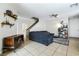 Inviting living room area with tile flooring, a comfortable sofa, and stylish decor at 6745 Jackson Junction St, Las Vegas, NV 89149