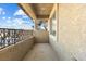The home has a balcony with rod iron details that provide an elevated outdoor living space at 6909 Forest Gate St, North Las Vegas, NV 89084