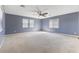 Spacious bedroom features neutral walls, carpeting and a ceiling fan for added comfort at 6909 Forest Gate St, North Las Vegas, NV 89084
