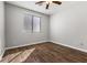 Clean bedroom with a window and hardwood floors at 6909 Forest Gate St, North Las Vegas, NV 89084