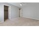 Bedroom with plush carpeting features neutral walls and multiple doors at 6909 Forest Gate St, North Las Vegas, NV 89084