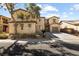 Charming two-story home with a two car garage and well-manicured front yard at 6909 Forest Gate St, North Las Vegas, NV 89084