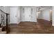 Bright foyer with staircase, hardwood floors, and white doors at 6909 Forest Gate St, North Las Vegas, NV 89084